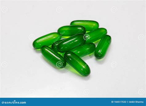 Softgel Capsules On Reflective Surface Royalty-Free Stock Image | CartoonDealer.com #88789402