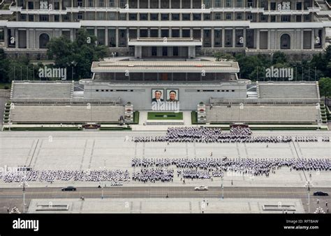 Kim Il Sung Square, hordes of young people rehearsing marching routines ...