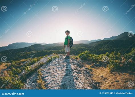 A Boy on Top of a Mountain. Stock Image - Image of landscape, achievement: 124602343