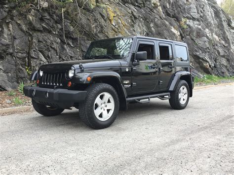 Top 50+ imagen black jeep wrangler 4 door - Abzlocal.mx