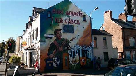 Political murals in the Falls Road and Shankill Road neighborhoods in Belfast, Northern Ireland ...