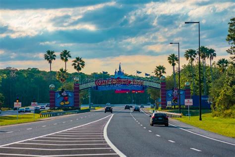 Entrance Arch of Walt Disney World Theme Parks on Beautiful Sunset Background at Lake Buena ...