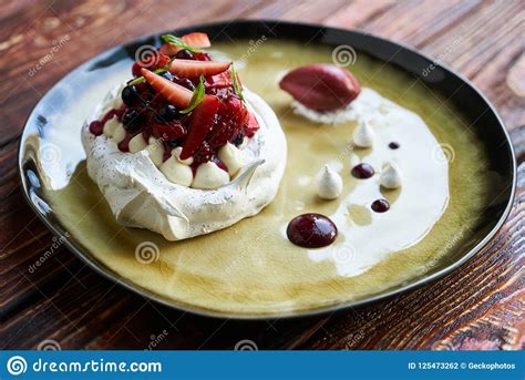 Pavlova Cake with Whipped Cream, Raspberry Jam and Assorted Fruit and ...