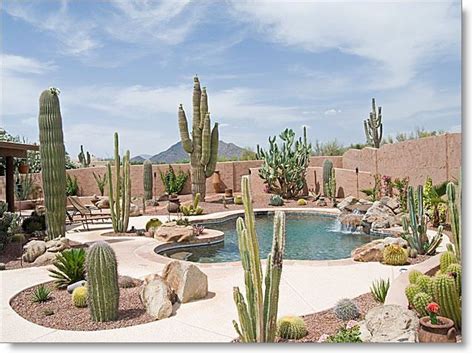 Stunning backyard landscaping with pool, water fall and heated spa. Black Mountain views ...