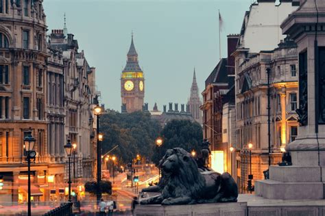 Street view of Trafalgar Square at night in London - Travel Off Path