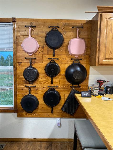 Cast iron skillet wall | Iron storage, Cast iron, Tiny kitchen