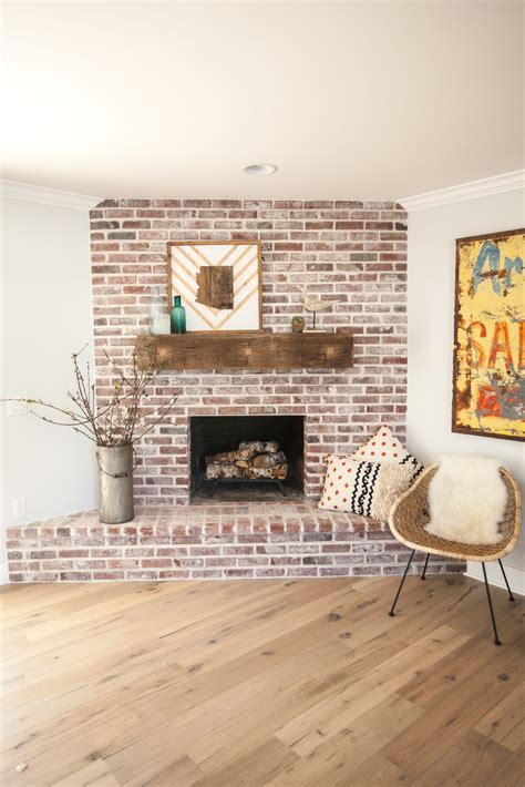 Custom brick fireplace with antique white mortar and custom reclaimed barn wood mantel - as ...