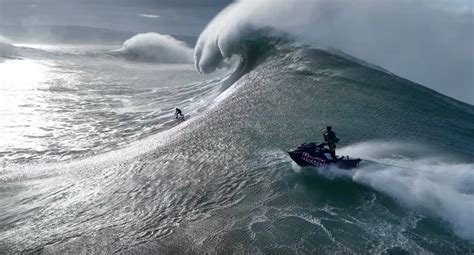 Drone video captures surfers braving liquid mountains at Nazaré