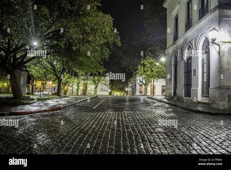 Night view of the old buildings and trees of a small town Stock Photo - Alamy