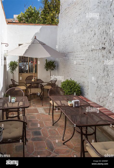 A patio of a small coffee shop patio, wedged between 2 buildings, in Tequisquiapan, Queretaro ...