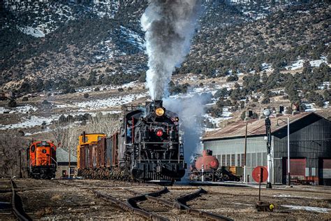 Nevada Northern Railway 93 pulls a string of ore cars out of the yard at Ely Nevada Photograph ...