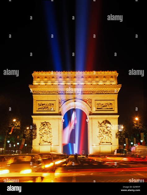 Arc de Triomphe, at night with the tricolour and laser lights, Paris ...