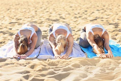 Group of Women Practising Yoga on the Beach Stock Image - Image of baltic, beach: 60286465