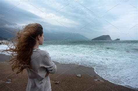 Woman looking into sea | High-Quality Nature Stock Photos ~ Creative Market