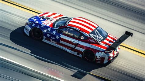 American flag racing car, patriotic car design, race track speed blur ...