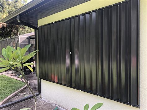 Accordion Shutters - Tropic Storm Protection Inc.