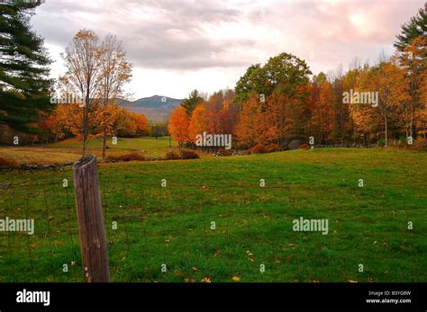 North America, USA, New Hampshire. A view across fall scenery towards Mount Monadnock Stock ...