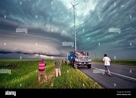 Storm chasing. Tornado researchers outside a Doppler on Wheels (DOW ...