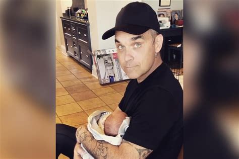 Robbie Williams cuddles newborn son Beau in sweet Instagram video ...