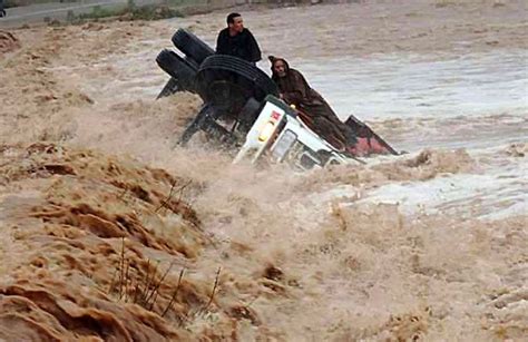 Drivers and a truck are stranded in flood waters in the southern region ...