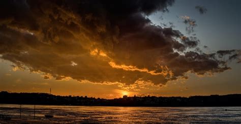 Premium Photo | Beautiful panorama of the sunset over the lake in the crisis an incredibly ...