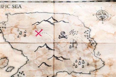 Close Up To Vintage Folded Fake Map with Red Cross of Pirates Treasure Chest Stock Image - Image ...