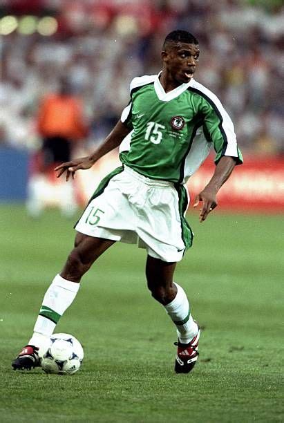 a soccer player in action on the field during a match between mexico ...