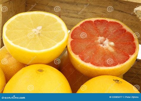 Yellow and Red Grapefruit and a Cut One Stock Image - Image of citrus ...