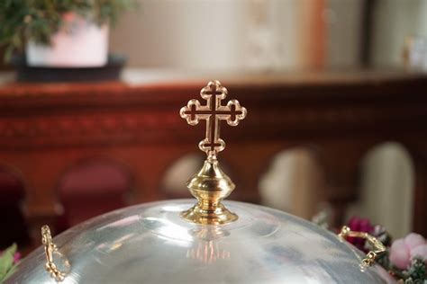 Premium Photo | Golden orthodox cross in the church, a symbol of baptism