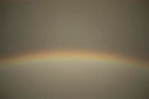 Premium Photo | Rainbow in sky atmospheric phenomenon refraction of light celestial view