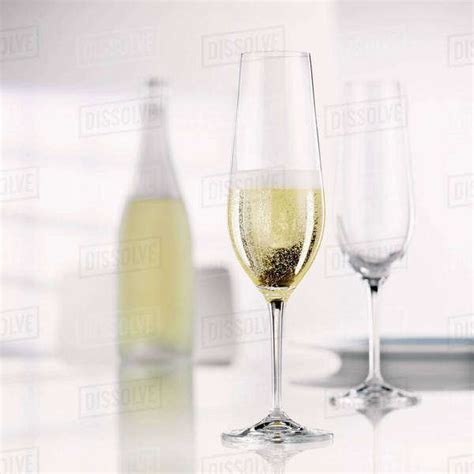 Sparkling Sekt in a Sekt glass - Stock Photo - Dissolve