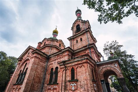 Exterior of old brick church in park — religion, from below - Stock ...