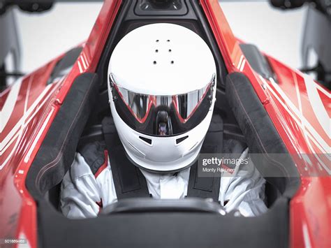 Racing Driver Wearing Crash Helmet In Supercar High-Res Stock Photo - Getty Images