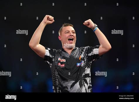 Chris Dobey celebrates victory over Michael van Gerwen during day ...