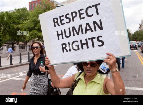 Human rights activist holding sign - Washington, DC USA Stock Photo - Alamy