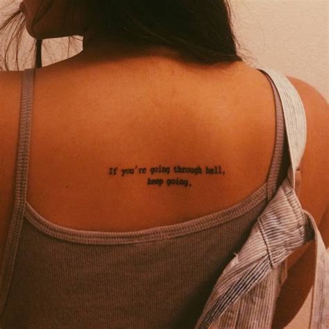 "If you are going through hell, keep going" tattoo on