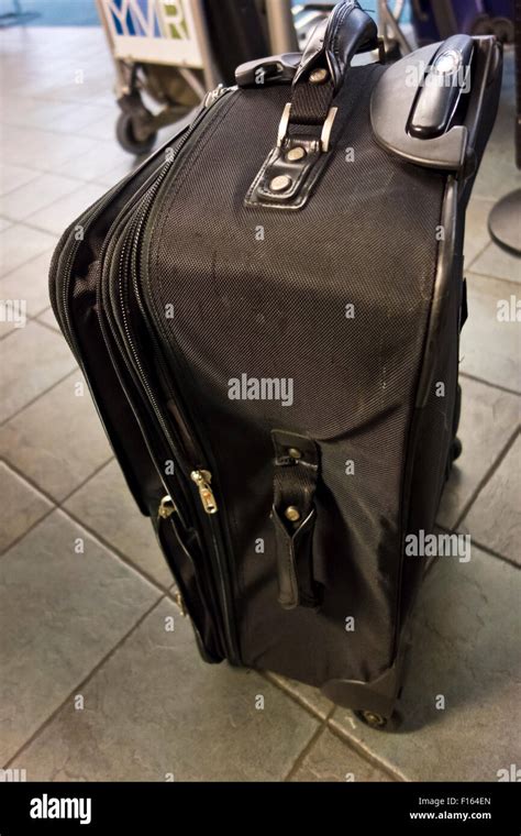 Damaged suitcase baggage after a flight arriving at Vancouver airport Stock Photo - Alamy