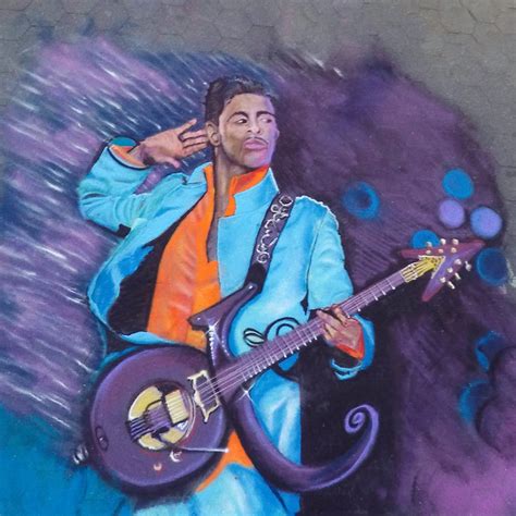 Sand Artist Recreates the Iconic Photo of Prince Playing 'Purple Rain ...