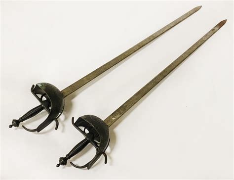 PAIR OF TOLEDO STEEL SWORDS - Southgate Auction Rooms