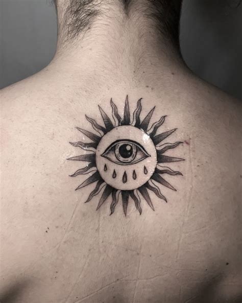 Sun and eye tattoo - Avantgarde Tattoo Barcelona