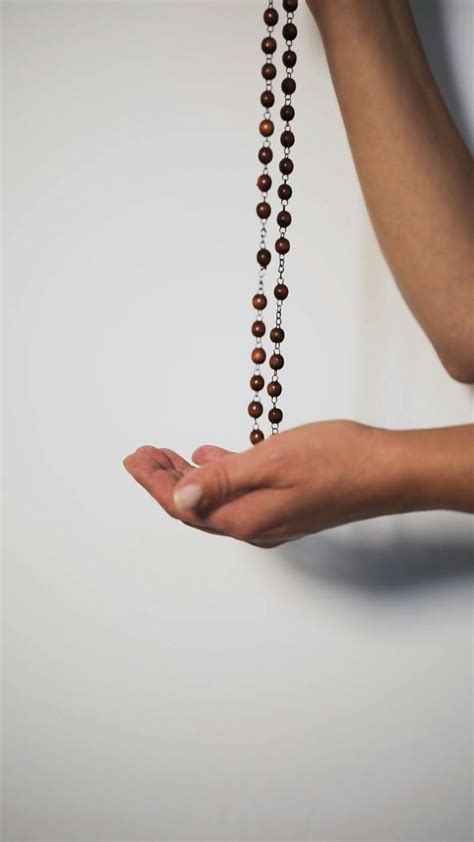 Man Holding a Rosary While Praying · Free Stock Video