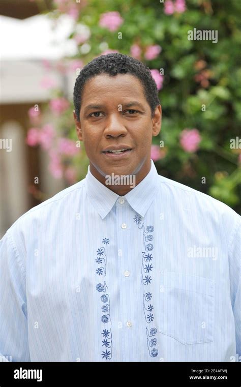 US actor Denzel Washington poses for a photocall to present his movie ...