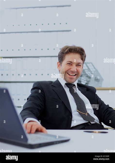 happy businessman in office Stock Photo - Alamy