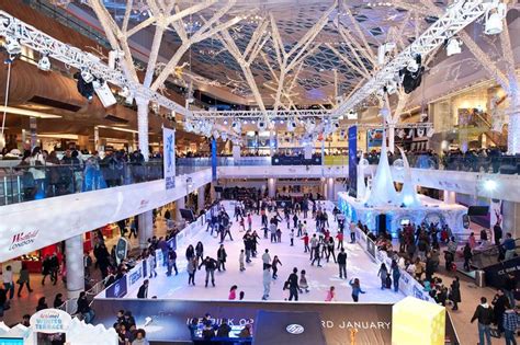 Seasonal change inside Westfield London with an ice rink addition # ...