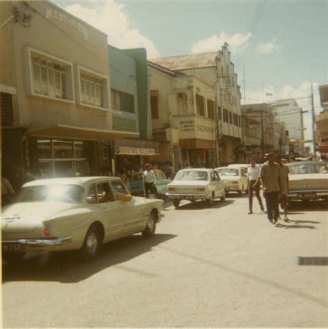 Photographed in Trinidad: In the foreground, a Valiant, background left, 2 Hillman Hunters and ...