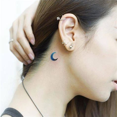 Blue crescent moon tattoo behind the right ear. | Moon tattoo, Crescent moon tattoo, Tattoos