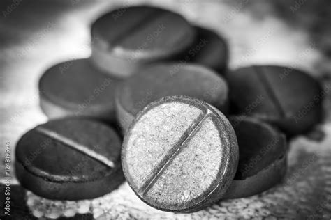 Activated charcoal tablets Stock Photo | Adobe Stock