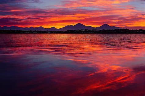 Premium Photo | Sunset dramatic sky with clouds over mountain range