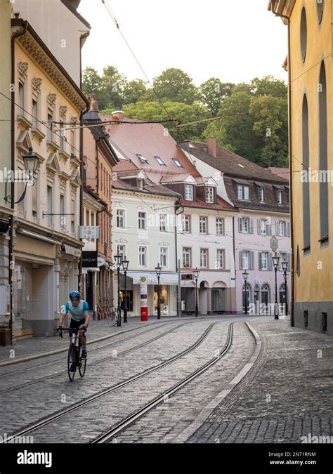 Road cyclist in Freiburg. Passage through the Salzstr in the old town ...