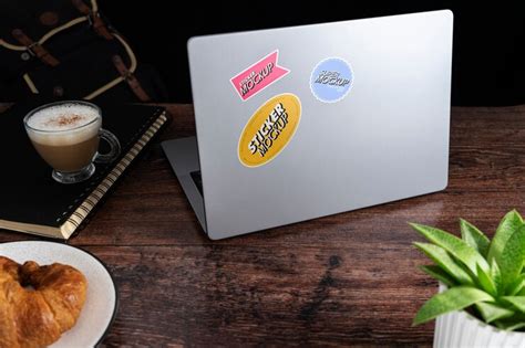 Premium PSD | Adhesive sticker on laptop device